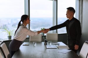 Business handshake symbolizing third party factory verification building trust