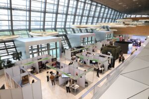 Busy trade fair exhibition hall representing Canton Fair follow up with Brazilian buyers